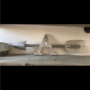 Decoration in form pf an A and arrow